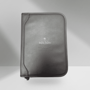 Stay organized in style with this professional leather-bound journal featuring the Bolton Empowerment Foundation logo. Includes a plain 50-sheet writing pad and convenient interior pockets for business cards, notes, and essentials. Your purchase makes an impact. Every item from our store helps fund mentorship, education, and wellness programs for youth in foster care and individuals facing breast cancer.